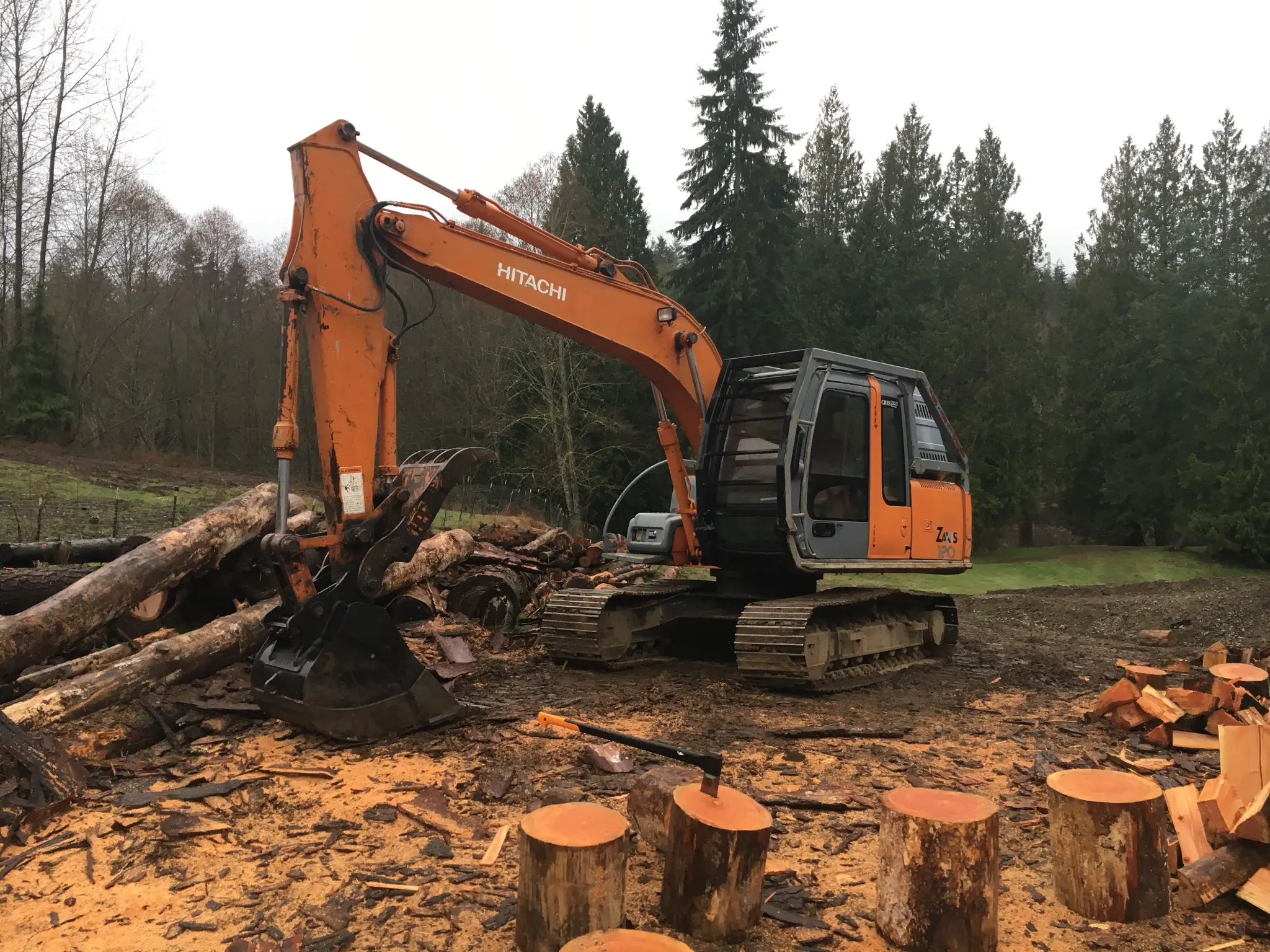 Pilchuck Construction excavator clearing land for commercial site preparation in Snohomish County