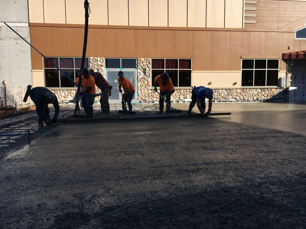 Pilchuck Construction crew placing and finishing concrete at a commercial building in Western Washington