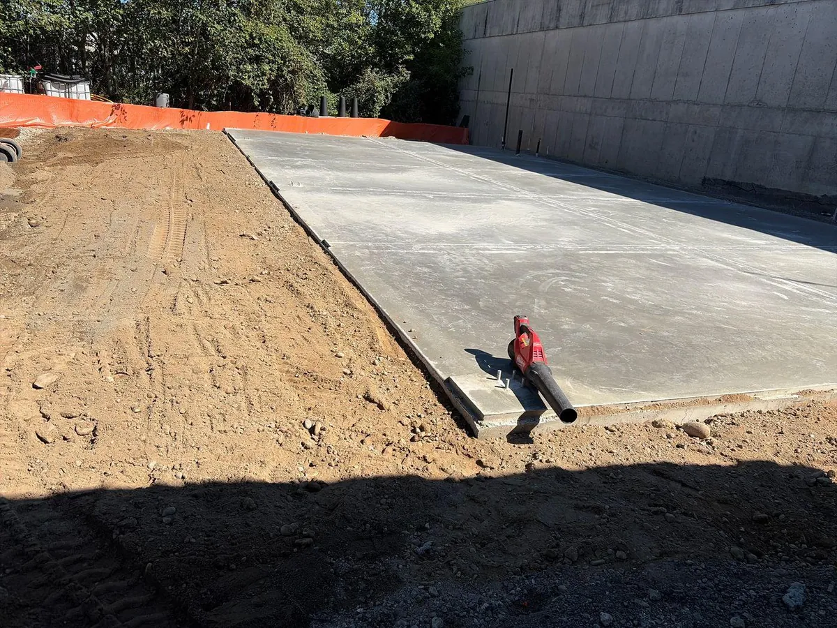 Finished concrete slab at the Somerset Gardens metal shop project in Edmonds, Washington