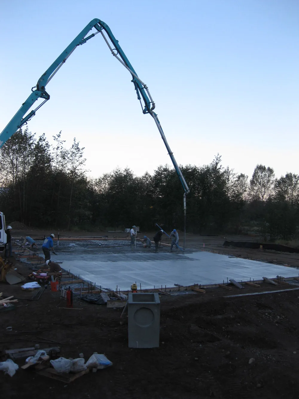 Concrete pour in progress on industrial slab